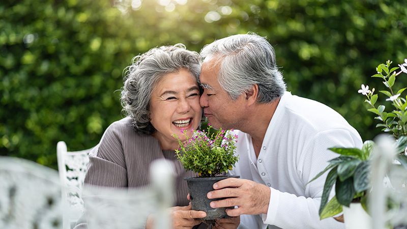 senior man kissing his wife