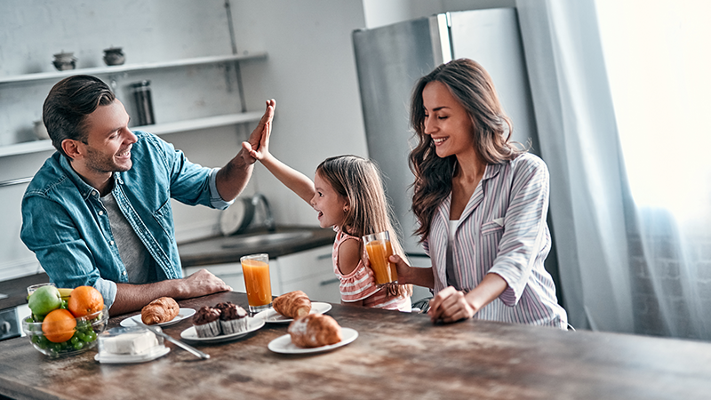 father high giving daughter at the dining table