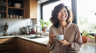 happy smiling woman in her kitchen